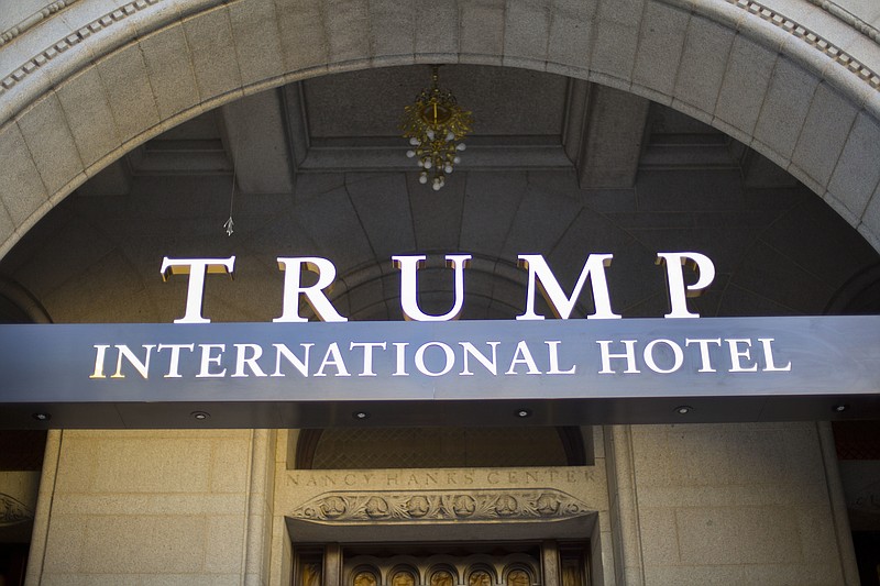 
              FILE - This Monday, Sept. 12, 2016, file photo, shows the exterior of the Trump International Hotel in downtown Washington. The Trump Organization says it will not ask guests at its hotels and resorts if they are using money from foreign governments to pay their bills, setting up a possible showdown with Democrats who accuse the president of violating the U.S. Constitution. (AP Photo/Pablo Martinez Monsivais, File)
            