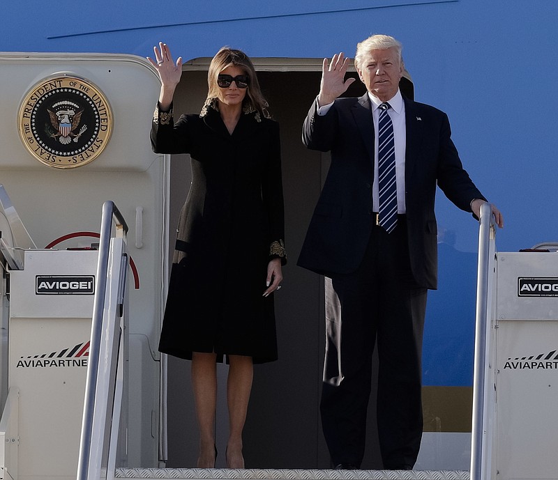 
              US President Donald Trump and his wife Melania arrive at Fiumicino's Leonardo Da Vinci International airport, near Rome, Tuesday, May 23, 2017. Trump is in Italy for a two day visit, including a meeting with Pope Francis at the Vatican, ahead of his participation in a NATO summit in Brussels on Thursday. (AP Photo/Andrew Medichini)
            