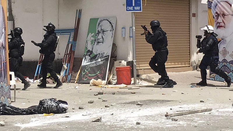 
              This image provided by an activist who requested to remain unnamed, shows Bahraini security forces during a raid on a sit-in demonstration, in Diraz, Bahrain, Tuesday, May 23, 2017. Bahrain police raided a town where the sit-in has been going on for months in support of Sheikh Isa Qassim, a prominent Shiite cleric, who had his citizenship stripped by the government. An activist said one protester was killed. Bahrain's Interior Ministry said on Twitter Tuesday that the operation targeting Diraz was to "maintain security and public order." (AP Photo)
            