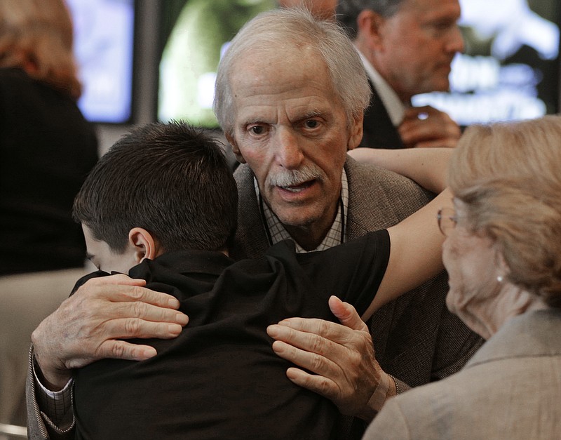 
              Former team owner Robert Yates is congratulated by a family member after being named as a member of the class of 2018 during an announcement at the NASCAR Hall of Fame in Charlotte, N.C., Wednesday, May 24, 2017. (AP Photo/Chuck Burton)
            