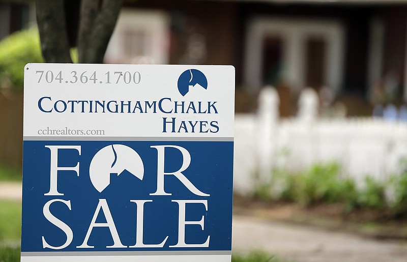 
              In this Thursday, April 27, 2017, photo, a "For Sale" sign is posted in front of a home in Charlotte, N.C. On Wednesday, May 24, 2017, the National Association of Realtors reports on sales of existing homes in April. (AP Photo/Chuck Burton)
            