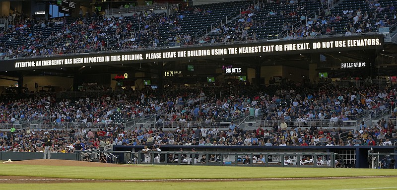 A message warning flashes on a sign board during the first inning of a baseball game between the Pittsburgh Pirates and Atlanta Braves, Tuesday, May 23, 2017, in Atlanta. The game continued uninterrupted. (AP Photo/John Bazemore)