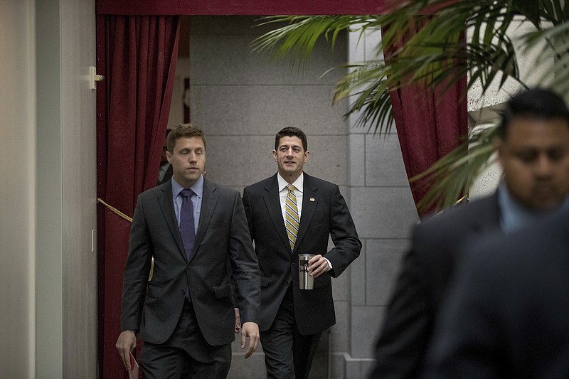 
              House Speaker Paul Ryan of Wis., center, arrives for a GOP caucus meeting on Capitol Hill in Washington, Tuesday, May 23, 2017. (AP Photo/Andrew Harnik)
            