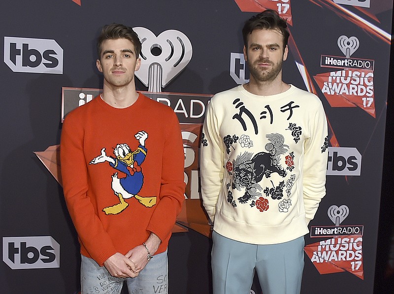 
              FILE - In this March 5, 2017 file photo, Drew Taggart, left, and Alex Pall, of The Chainsmokers, appear at the iHeartRadio Music Awards in Inglewood, Calif. The duos of Florida Georgia Line and the Chainsmokers will pair up together for a cross-genre performance at the CMT Awards on June 7. (Photo by Jordan Strauss/Invision/AP, File)
            