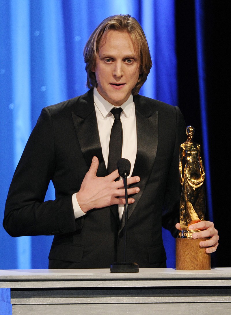 
              FILE - In this Oct. 8, 2014, file photo, classical ballet dancer David Hallberg accepts the Princess Grace Statue Award at the 2014 Princess Grace Awards Gala in Beverly Hills, Calif. Hallberg is working on a memoir about his rise from childhood bullying victim to principal dancer for the American Ballet Theatre and Bolshoi Ballet. Hallberg’s “A Body of Work: Dancing to the Edge and Back” will be published November 7. (Photo by Chris Pizzello/Invision/AP, File)
            