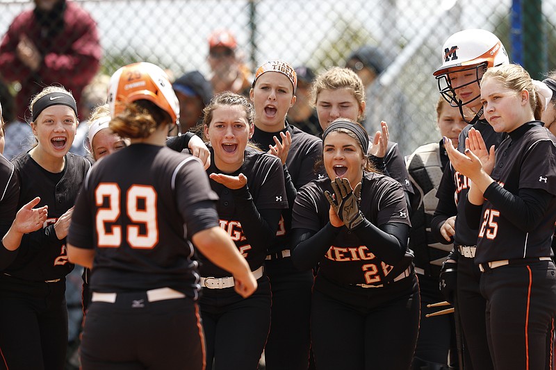Teammates congratulate Meigs County batter Lindsey Ward at home after her homer during their TSSAA Class A girls state softball tournament losers-bracket game against Scotts Hill on Thursday, May 25, 2017, in Murfreesboro, Tenn.