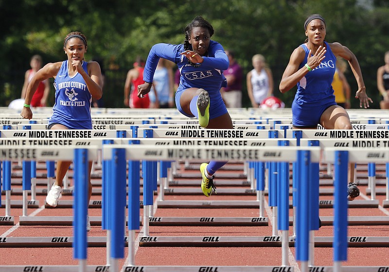 CSAS's Lennex Walker, center, is on her way to winning the girls' 100-meter hurdles, flanked by MLK's Denia Hill-Tate, right, and Unicoi County's Stephanie Wisse on Thursday in Murfreesboro.