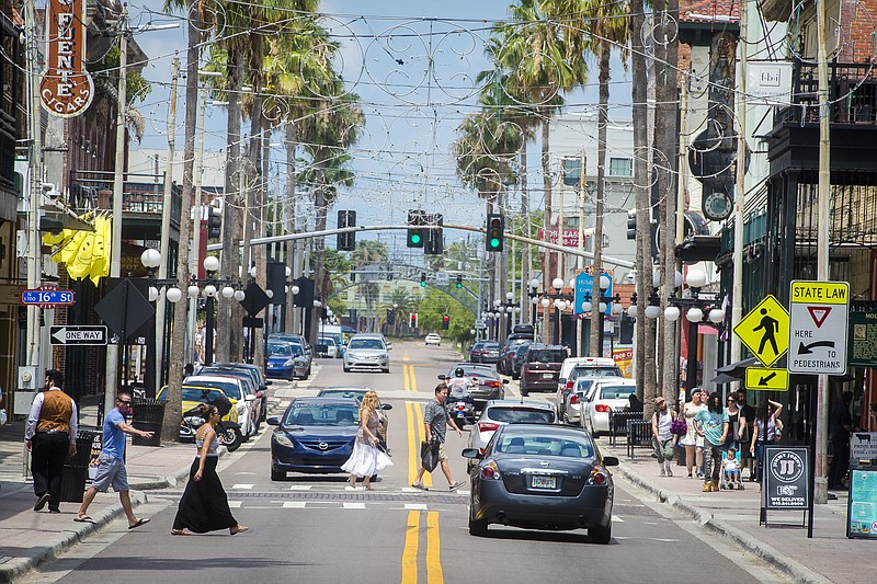 Seventh Avenue, the main strip of Ybor City in Tampa, buzzes with visitors. Florida represents so much that's good, bad and bizarre about the United States, all rolled into one long state.