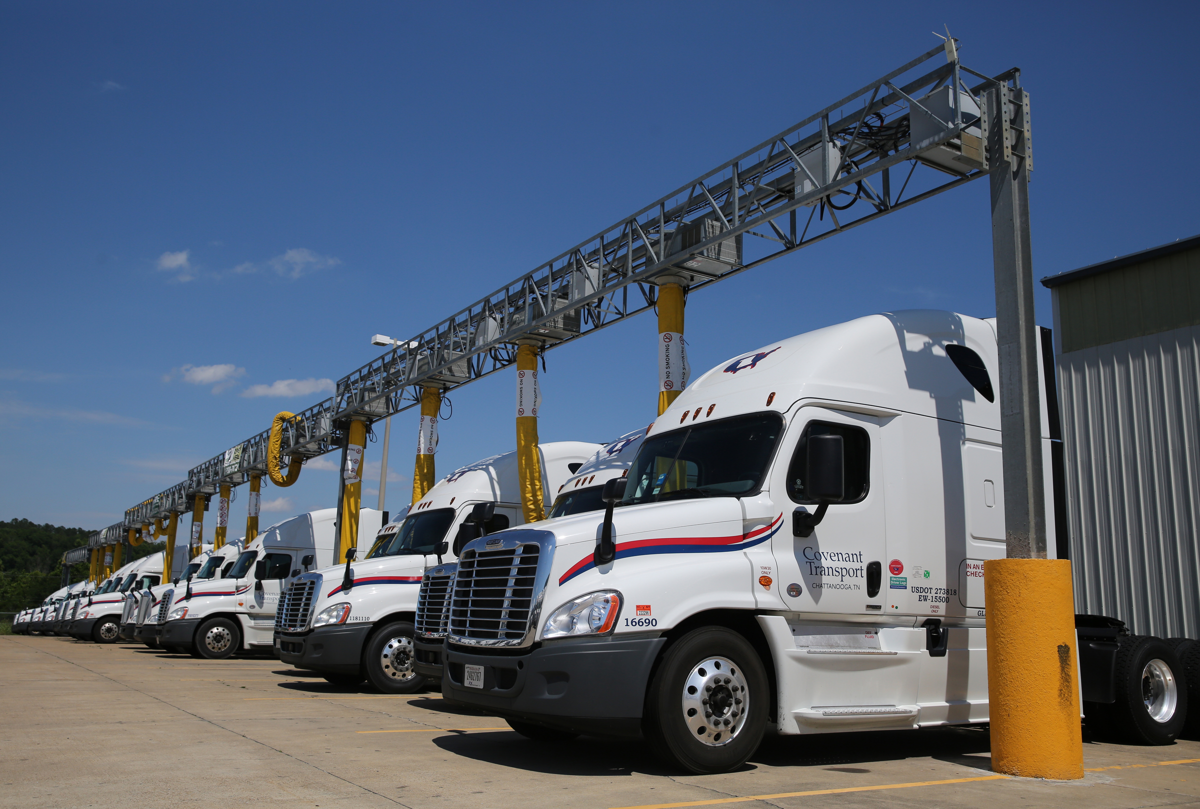 Trucks sit in a IdleAir system terminal Friday, May 26, 2017, at Covenant Transport in Chattanooga, Tenn. The trucking company installed a terminal that supplies electricity to up to 20 trucks, so drivers can run their onboard appliances, use Wi-Fi and keep warm or cool as they wait on loads or take mandatory rest breaks.