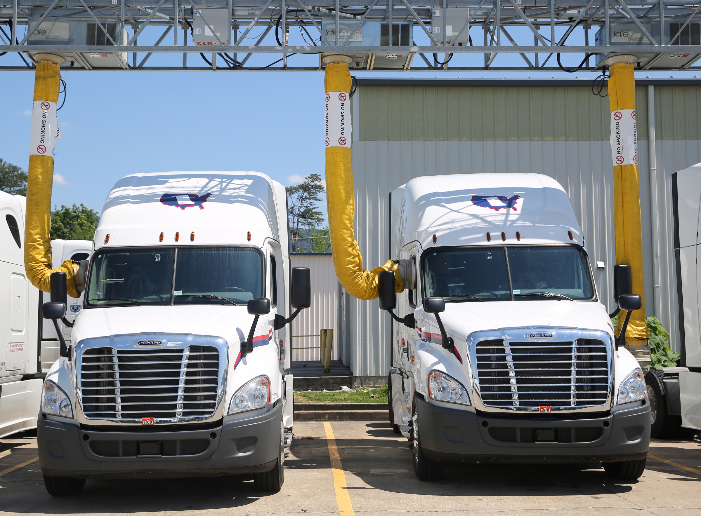 Trucks sit in a IdleAir system terminal Friday, May 26, 2017, at Covenant Transport in Chattanooga, Tenn. Covenant's IdleAir program recently won a state sustainable transportation award.