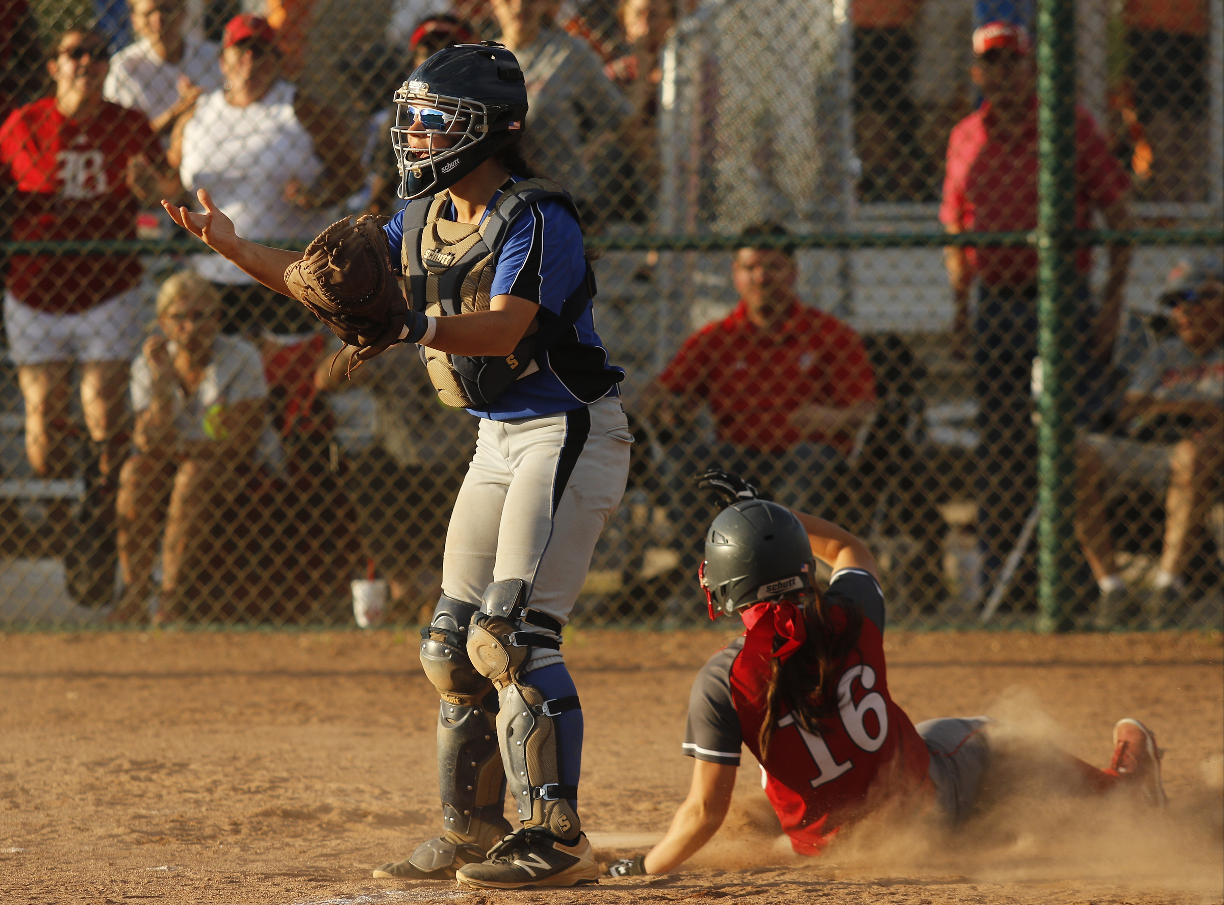 Baylor's Ashton Brazzell slides into home as GPS catcher Haley Smith looks for a throw during their second game in the Division II-AA championship round Friday night in Murfreesboro. Baylor won 6-1 after winning the first game 10-7.
