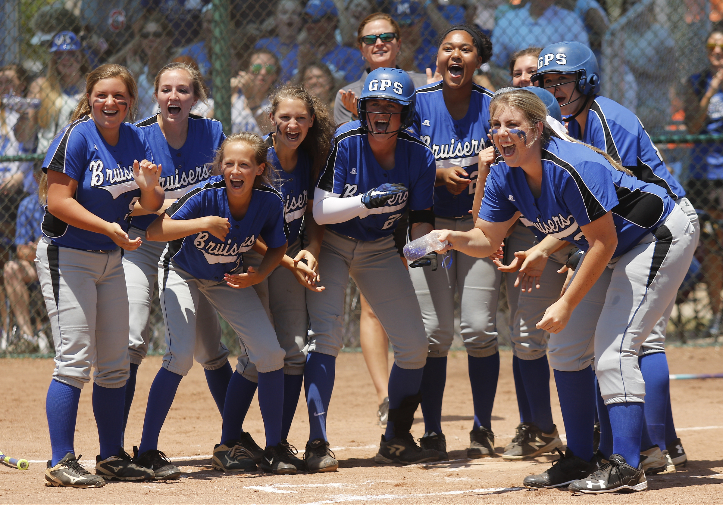 GPS players wait at home after teammate Hannah Kincer's homer during their TSSAA Division II-AA state softball championship game 1 against Baylor on Friday, May 26, 2017, in Murfreesboro, Tenn.
