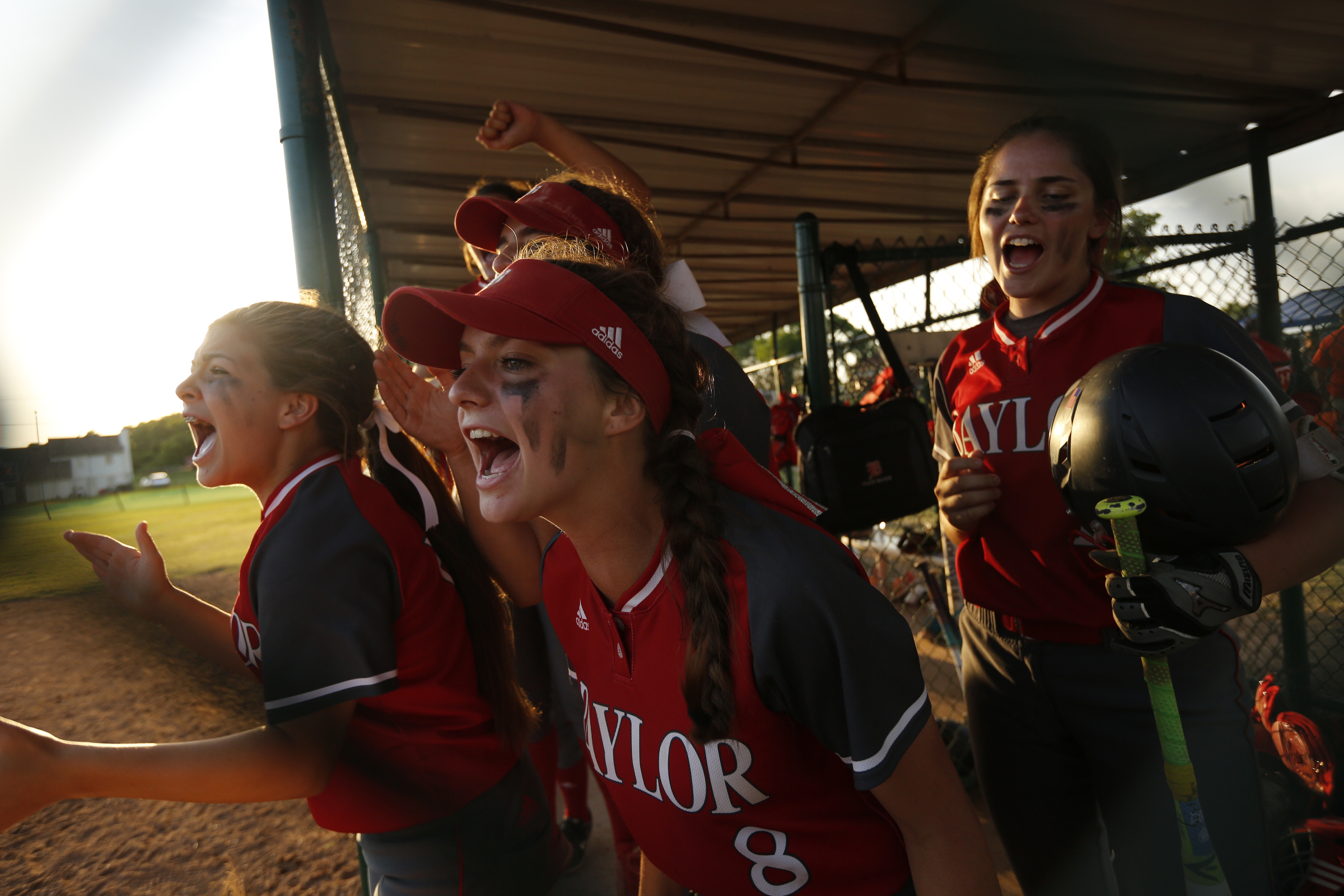 Baylor players cheer in the dugout after scoring a run during their second win Friday night against rival GPS. The Bruisers beat Baylor 7-1 on Thursday.