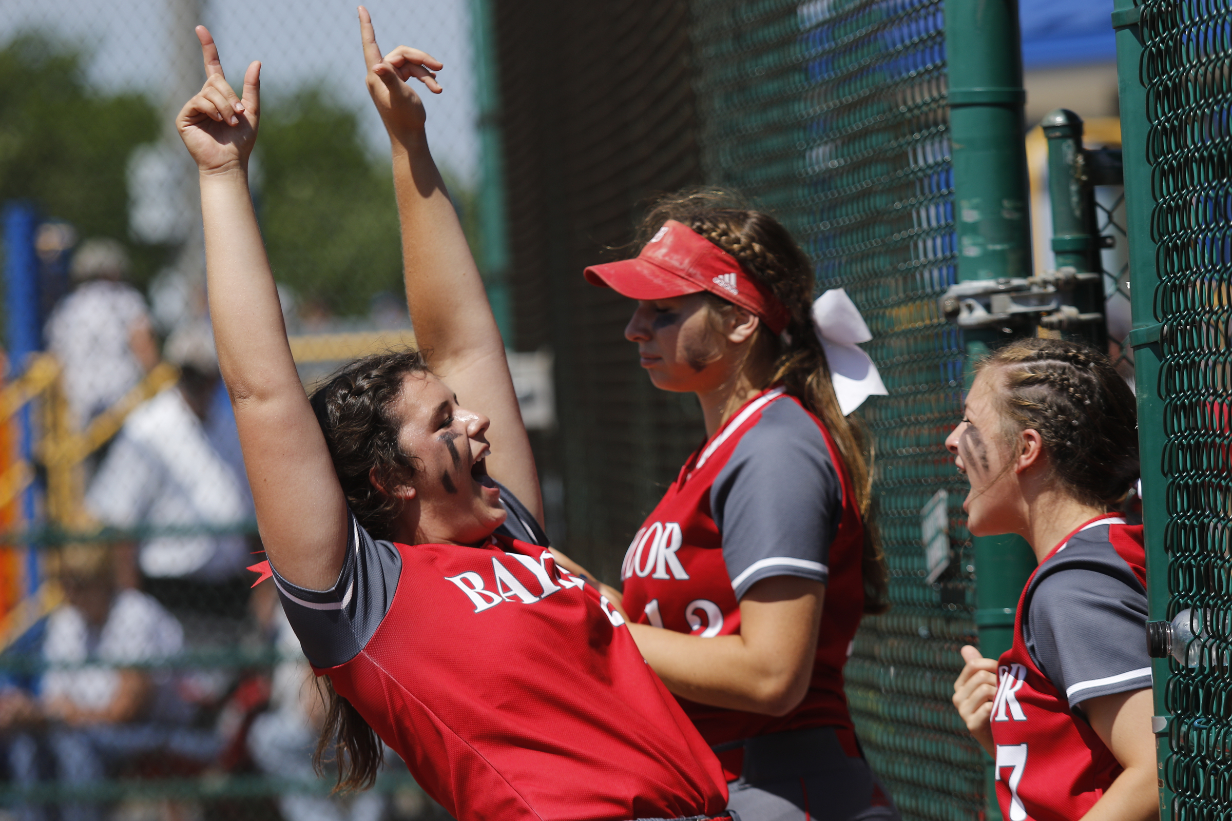 Baylor's MAcy McKnight, left, celebrates a run during their TSSAA Division II-AA state softball championship game 1 against GPS on Friday, May 26, 2017, in Murfreesboro, Tenn.