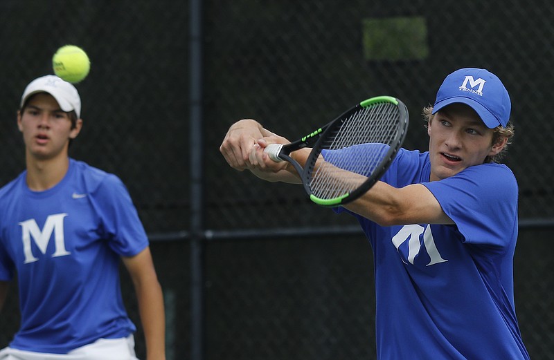 McCallie's Ryan Crump returns the ball during the Division II-AA boys' tennis tournament doubles final with Charlie Thel against Baylor's Benjamin Traverne and Alec Kadrie in Murfreesboro. Thel and Crump won the championship.