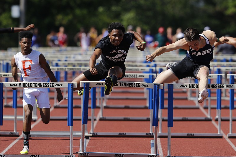 CSAS freshman Brevin Sims, center, paces Page's Michael McMahan, right, and Fairley's Malik Mcadory in the TSSA boys state championship A-AA 110 meter hurdles on Friday, May 26, 2017, in Murfreesboro, Tenn. 