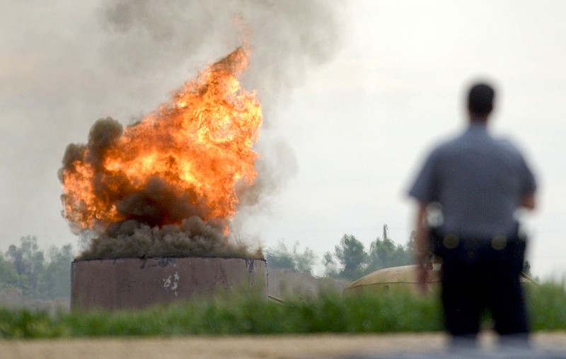
              An oil tank burns after an explosion at a tank battery owned by Anadarko near the Grand View Estates neighborhood in Weld County on Thursday, May 25, 2017 in Mead, Colo.  The fatal oil tank battery fire in northern Colorado appears to be unrelated to a nearby home explosion last month caused by a leaky gas line. (Lewis Geyer/Daily Camera via AP)
            