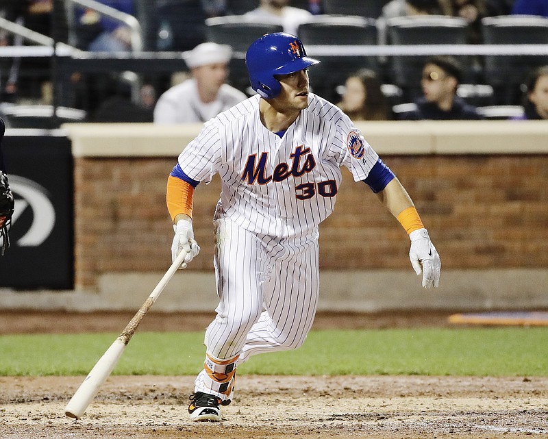 
              New York Mets' Michael Conforto (30) follows through on a RBI single during the fourth inning of a baseball game against the San Diego Padres Wednesday, May 24, 2017, in New York. (AP Photo/Frank Franklin II)
            