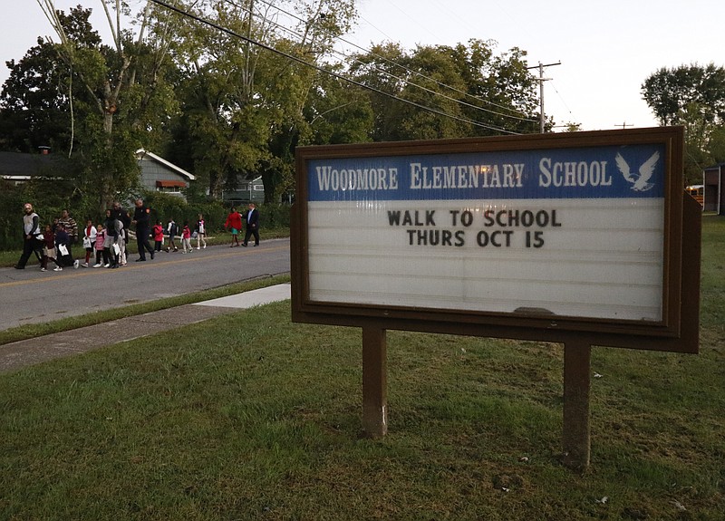 In this 2015 file photo, students walk from New Monumental Baptist Church to Woodmore Elementary as a part of a health initiative. 