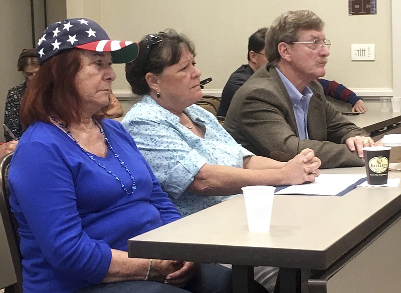 
              Supporters of a lawsuit against the San Diego school district listen during a news conference in San Diego, Calif., Thursday, May 25, 2017. Six parents have sued the San Diego school district, alleging that its anti-Islamophobia campaign favors Islam over other religions and grants special protections to Muslim students. District officials have vigorously defended the campaign, saying bullying of Muslim students is pervasive and vastly underreported. (AP Photo/Elliot Spagat)
            