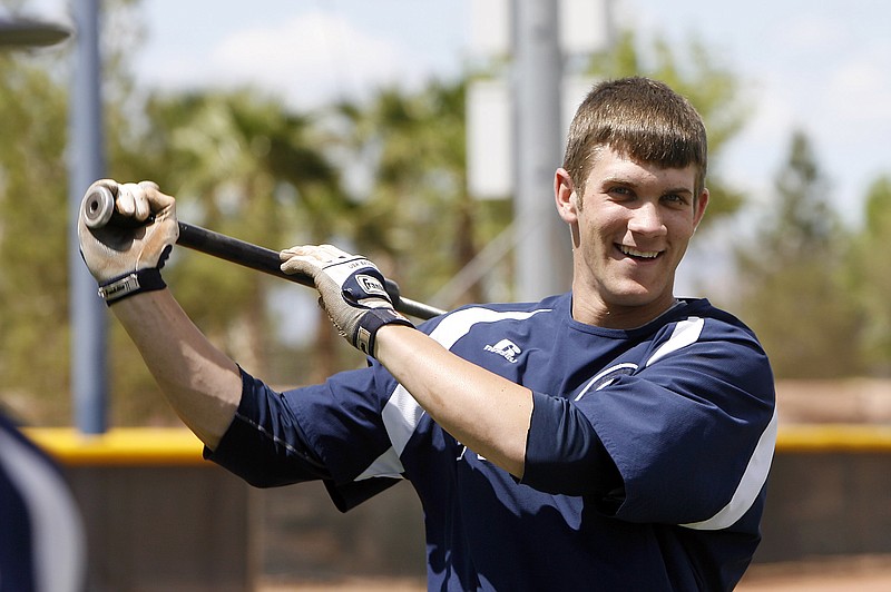 
              FILE - April 30, 2010, file photo, College of Southern Nevada baseball player Bryce Harper warms up before a college baseball game in Henderson, Nev. A few years before Bryce Harper was hitting home runs at big league ballparks, the slugger had dreams of bashing baseballs in western Colorado. Getting to Grand Junction, of all places, means you've made it to the JUCO World Series. And for every junior college player, that has been the dream destination since 1959.  (AP Photo/Isaac Brekken, File)
            