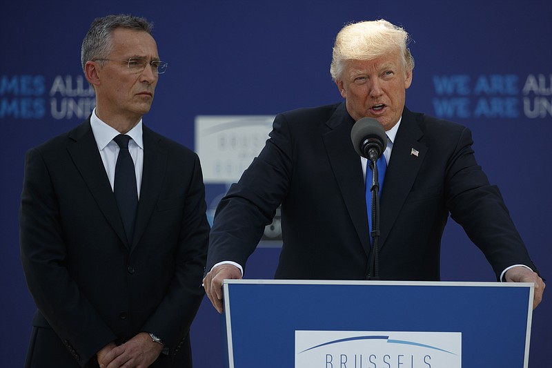 
              NATO Secretary General Jens Stoltenberg listens as President Donald Trump speaks during a ceremony to unveil artifacts from the World Trade Center and Berlin Wall for the new NATO headquarters, Thursday, May 25, 2017, in Brussels. (AP Photo/Evan Vucci)
            