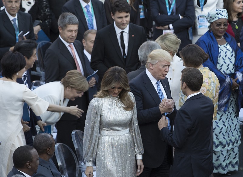 
              President Donald Trump, accompanied by first lady Melania Trump greets French President Emmanuel Macron and Brigitte Macron before a concert by the La Scala Philharmonic Orchestra at the Ancient Greek Theatre of Taormina, Sicily, Friday, May 26, 2017. German Chancellor Angela Merkel is second from left, Canadian Prime Minister Justin Trudeau is at center. (Stephen Crowley/The New York Times via AP, Pool)
            