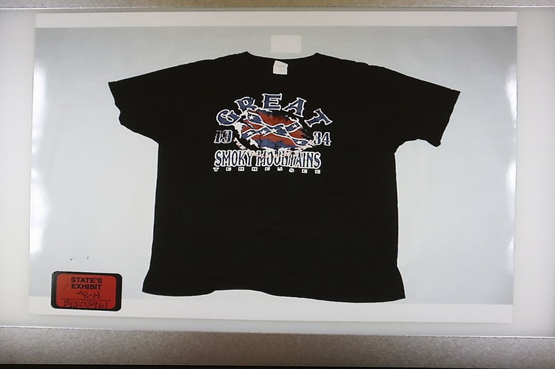 
              FILE – This Nov. 4, 2016, file photo shows a T-shirt with an illustration of a Confederate battle flag that Ray Tensing was wearing under his police uniform when he fatally shot unarmed black motorist Sam DuBose in 2015, submitted as evidence in Cincinnati. Hamilton County, Ohio, Judge Leslie Ghiz agreed with Tensing's defense attorneys Friday, May 26, 2017, that the shirt is potentially too prejudicial to allow as evidence in the former University of Cincinnati officer's retrial. (Cara Owsley/The Cincinnati Enquirer via AP, Pool, File)
            