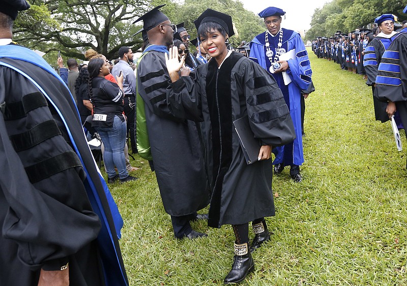 
              In this Saturday, May 13, 2017 photo, actress and singer Janelle Monae arrives before a graduation ceremony at Dillard University in New Orleans. Dillard University graduates more physics majors - and, notably, more female physics majors - than far bigger schools with more resources. The point was punctuated at Dillard’s recent commencement exercises, with a keynote address from Monae, a star of “Hidden Figures.”  (AP Photo/Gerald Herbert)
            