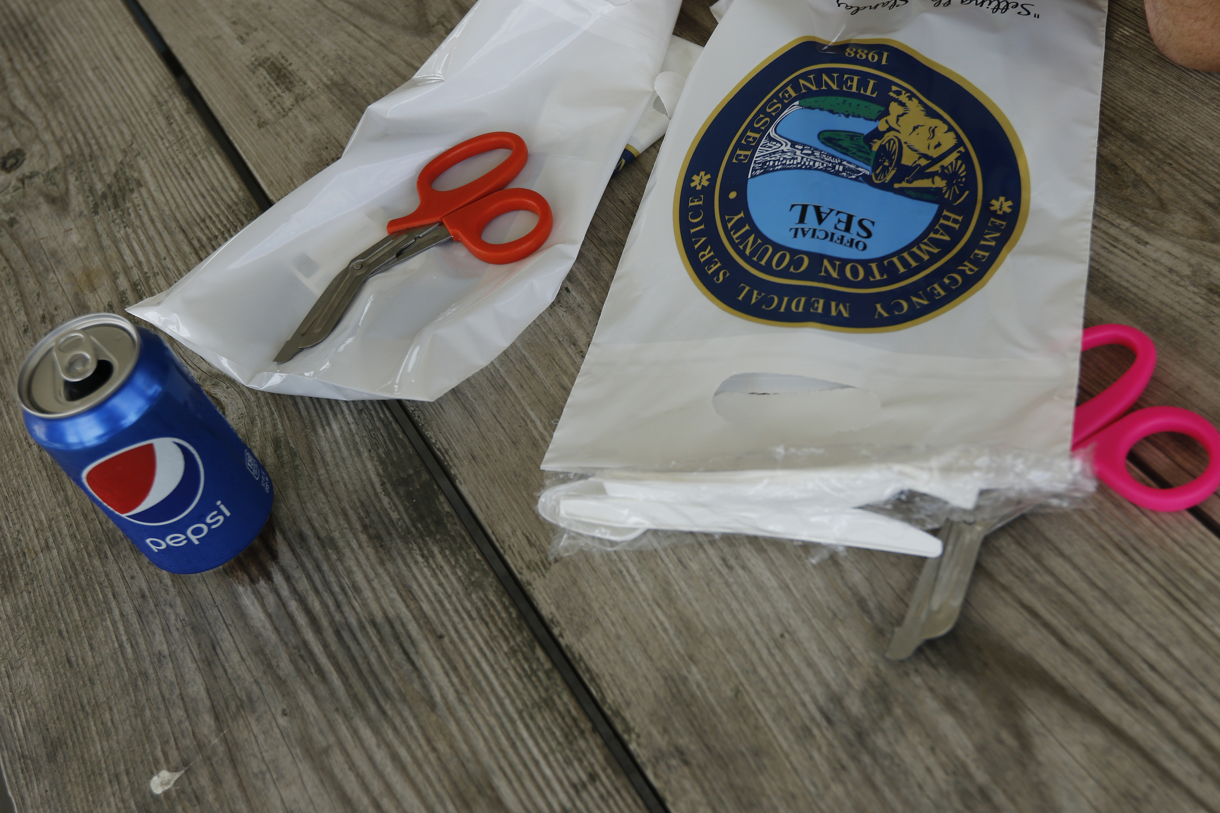 Emergency scissors sit near a pepsi at the Hamilton County EMS awards ceremony at the Vulcan Materials Plant's picnic area on Saturday, May 27, 2017, in Chattanooga, Tenn.