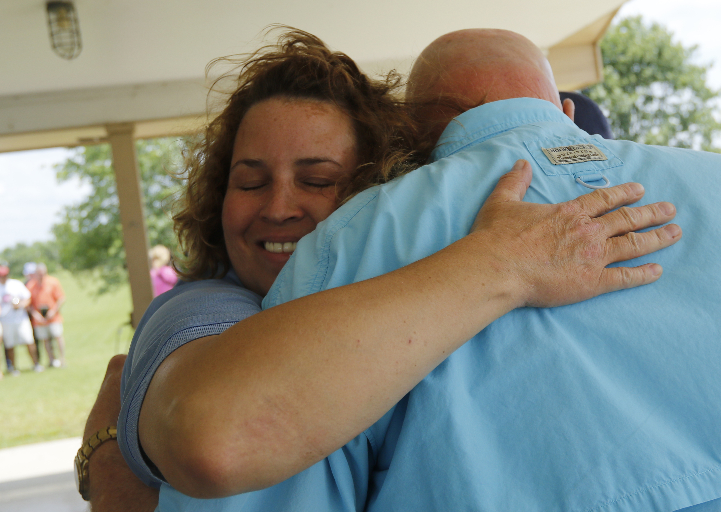 AEMT of the year Natasha Whitmire hugs HCEMS director Ken WIlkerson after receiving her award at the Hamilton County EMS awards ceremony at the Vulcan Materials Plant's picnic area on Saturday, May 27, 2017, in Chattanooga, Tenn.