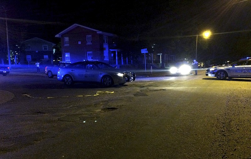 
              This image provided by the Virginia State Police shows law enforcement investigating the scene of a shooting early Saturday, May 27, 2017 in Richmond, Va.   Special Agent Michael T. Walter, a Virginia State Police special agent died Saturday after being shot by a man sitting in a car in Richmond, police said. The shooting suspect fled on foot, sparking an overnight manhunt that ended with the man’s arrest about an hour after the agent’s death.  Virginia State Police said in an emailed statement that Travis A. Ball of Richmond is being held without bond on charges that include malicious wounding and use of a firearm in the commission of a felony (Virginia State Police via AP)
            