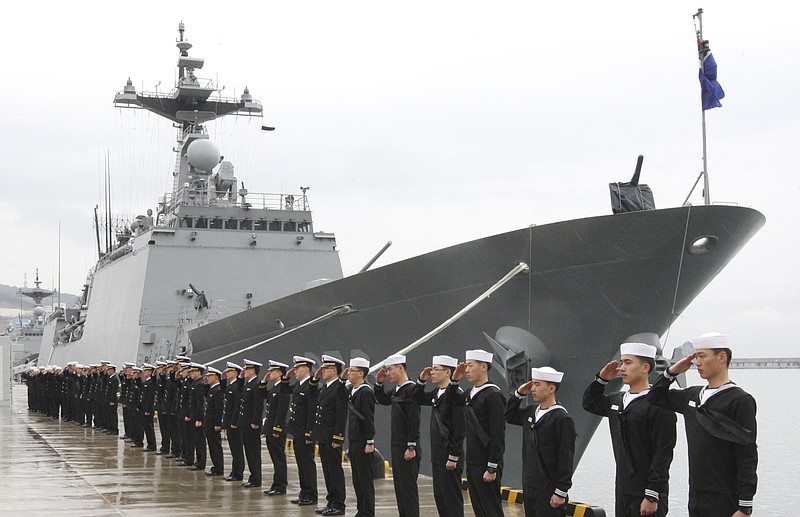 
              FILE - In this March 3, 2009 file photo, South Korean navy sailors salute in front of the destroyer "Great King Munmu," which will be sent to pirate-infested Somali water, during a launching ceremony to dispatch South Korean troops to Somali waters at a port in Busan, South Korea. South Korea's military has dispatched Saturday, May 27, 2017, a naval unit in waters off Somalia after pirates reportedly hijacked a South Korean fishing vessel. (Oh Soo-hee/Yonhap via AP, File)
            