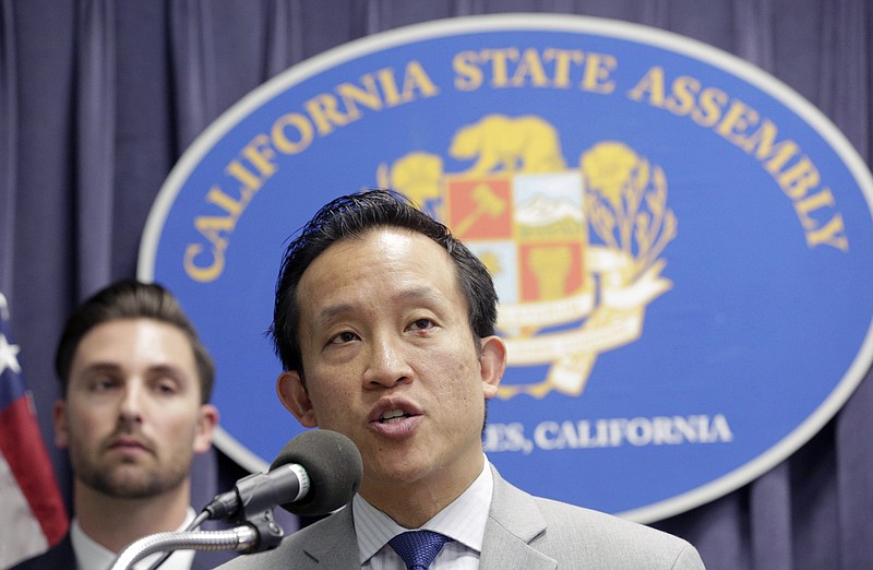 
              FILE - In this Mar. 17, 2017, file photo, Assemblyman David Chiu, D-San Francisco, Chair of the Assembly Committee on Housing and Community Development, right, speaks in Los Angeles. California Democrats are expanding their efforts to resist President Donald Trump's crackdown on illegal immigration with bills aimed at limiting how much private business people can cooperate with federal immigration authorities. A bill that would bar landlords from disclosing tenants' immigration status passed the Assembly on Monday, May 22, 2017. A measure prohibiting employers from letting immigration agents into their worksites without a warrant cleared a key committee Friday, May 26, 2017. (AP Photo/Nick Ut, File)
            