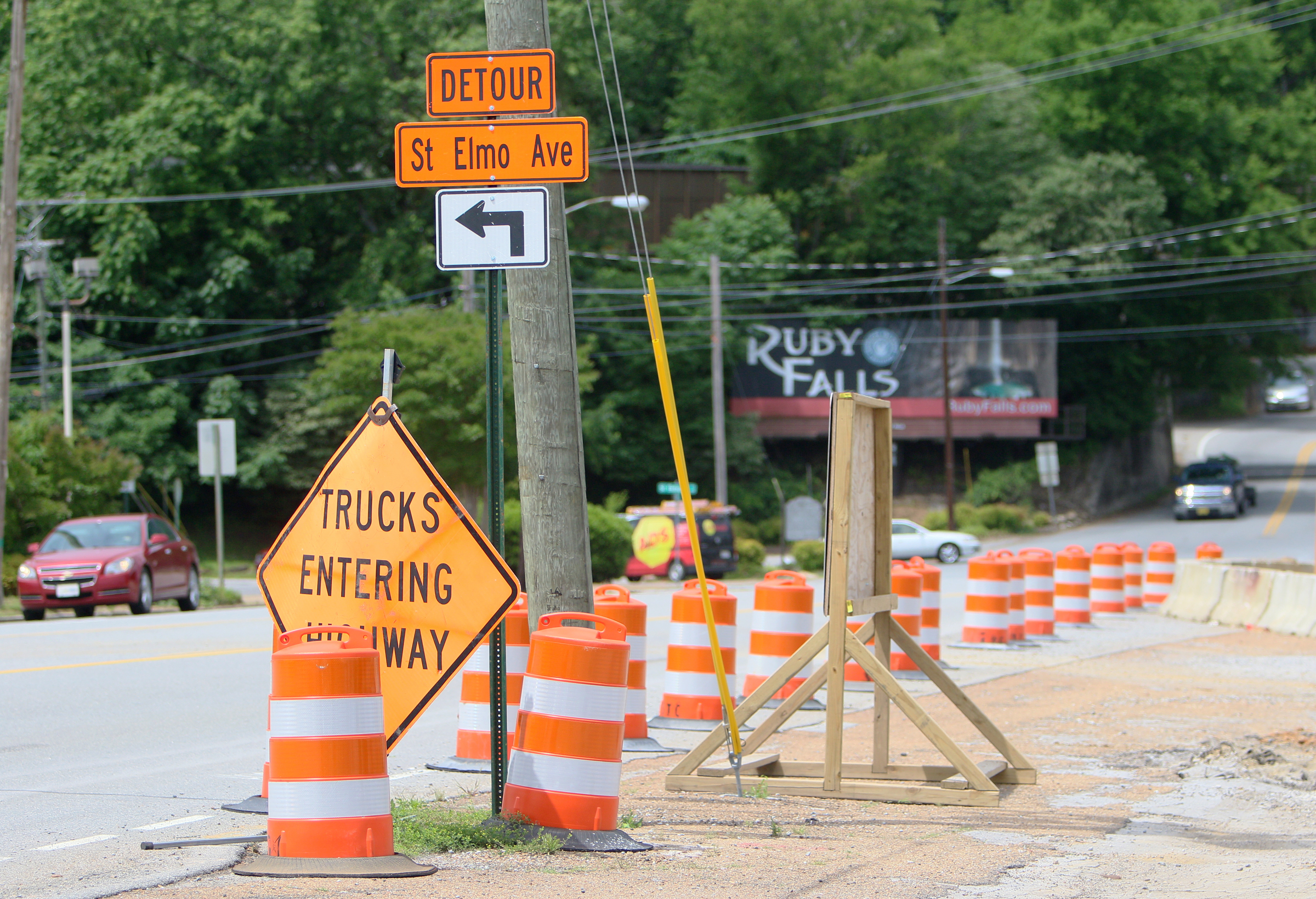 Construction barrels and signage has been put up along Broad Street in Chattanooga, Tenn., blocking portions of St. Elmo Avenue Friday, May 26, 2017, that are part of an excavation project getting started in the area. The intersection upgrade is part of a $17 million multiphase project to overhaul the St. Elmo basinճ drainage network.