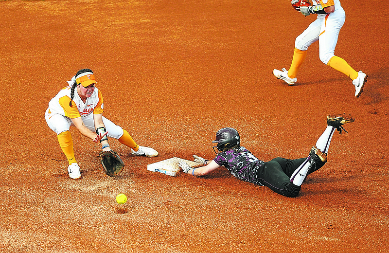 Tennessee shortstop Meghan Gregg (55) takes a throw as Texas A&M's Erica Russell (3) slides into to second base with a steal in game 3 of the NCAA Super Regional softball game Sunday, May 28, 2017 in Knoxville, Tenn. (Scott Keller/The Daily Times via AP)