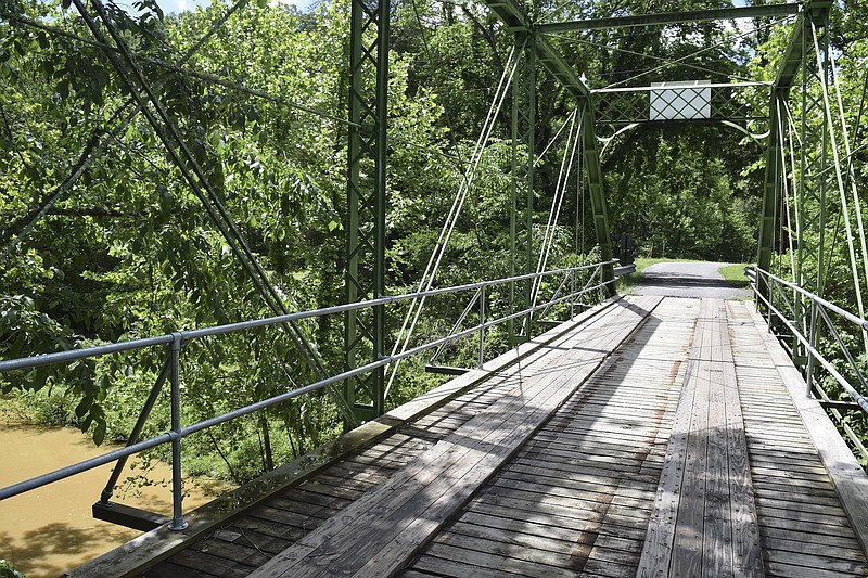 The 1884-era Henley Mill Bridge in Meigs County north of Decatur, Tenn., is among bridges that could go on the Tennessee Department of Transportation's three-year plan. The Henley Mill Bridge — closed a few years ago by the state — has since been restored by the county with new wood decking, rails and other components. A new bridge will be built alongside the old one.