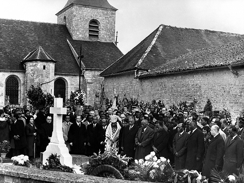 
              FILE - In this Nov. 13, 1970 file photo, Mourners gather at the tomb of former French President General Charles de Gaulle, in the cemetery of Colombey-les-Deux-Eglises, France, the day after his burial. French politicians are reacting with anger and dismay after the tomb of France's wartime hero and former President Gen. Charles de Gaulle was vandalized. French media say police are hunting for two people, one of whom was filmed Saturday, May 27, 2017 by security cameras knocking a cross off the top of tomb in Colombey-les-Deux-Eglises, the village in eastern France where De Gaulle lived and is buried. (AP Photo, file)
            