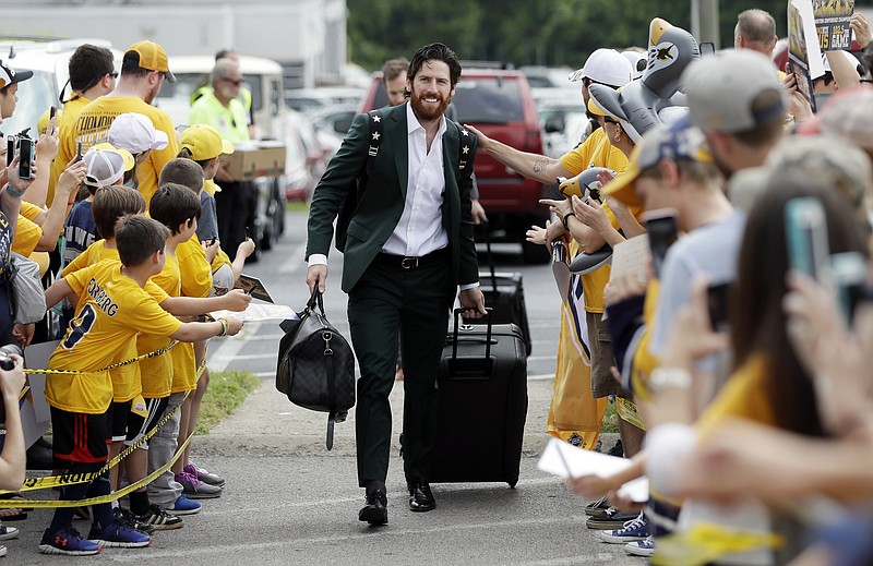 
              Nashville Predators right wing James Neal is greeted by fans as players arrive at the airport Saturday, May 27, 2017, in Nashville, Tenn., for their flight to Pittsburgh for the NHL hockey Stanley Cup Finals. The Predators face the Pittsburgh Penguins in Game 1 on Monday, May 29. (AP Photo/Mark Humphrey)
            