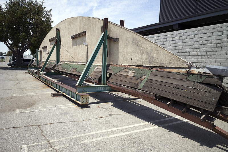 
              This May 23, 2017, photo shows part of the disassembled hangar facade that framed the opening scene of the 1942 film "Casablanca," where it is stored in a parking lot at Van Nuys Airport in Los Angeles' San Fernando Valley. Christine Dunn, who with her late husband recovered the hangar 10 years ago, told the Daily News on Sunday, May 28, that it'll be moved to Valley Relics Museum, home to many pop culture items. (David Crane/Los Angeles Daily News via AP)
            