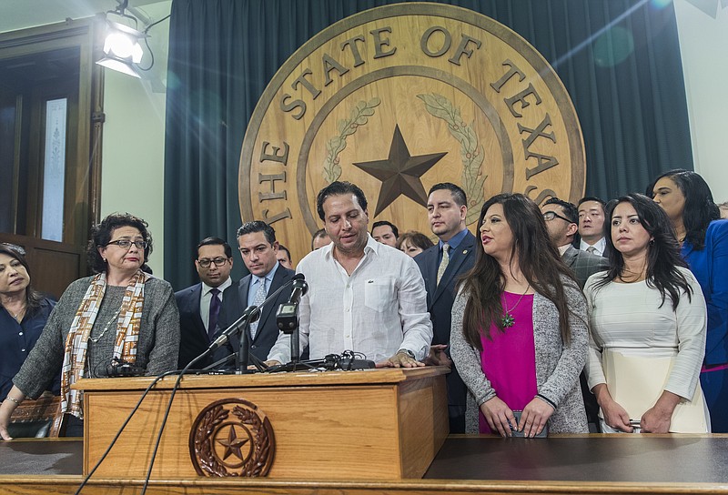 
              Texas House Rep. Poncho Nevarez of district 74 speaks about the altercation that he was involved on the house floor during the last day of session at the state Capitol in Austin Monday, May 29, 2017. A raucous end to a divisive Texas legislative session erupted Monday when a large protest over a “sanctuary cities” crackdown provoked a heated scuffle between lawmakers on the House floor. (Ricardo Brazziell/Austin American-Statesman via AP)
            