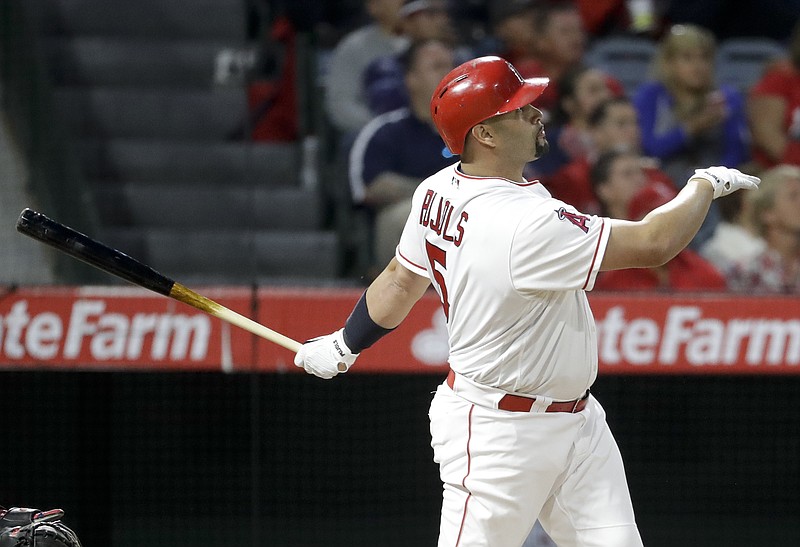 Los Angeles Angels' Albert Pujols watches his three-run home run against the Atlanta Braves during the third inning of a baseball game in Anaheim, Calif., Tuesday, May 30, 2017. Pujols now has 599 career home runs. (AP Photo/Chris Carlson)