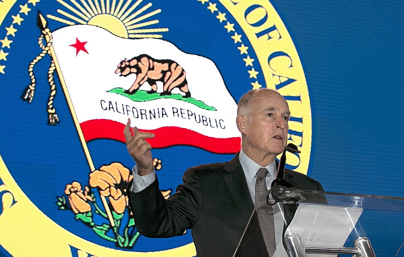 
              California Gov. Jerry Brown said he will need Republican's help to renew California's cap-and-trade program, while speaking at the California Chamber of Commerce 92nd Annual Sacramento Host Breakfast, Thursday, June 1, 2017, in Sacramento, Calif. The program, that caps the state's carbon emissions and requires polluters to obtain permits before releasing climate-change gasses, will expire in 2020 if lawmaker don't vote to renew it. (AP Photo/Rich Pedroncelli)
            