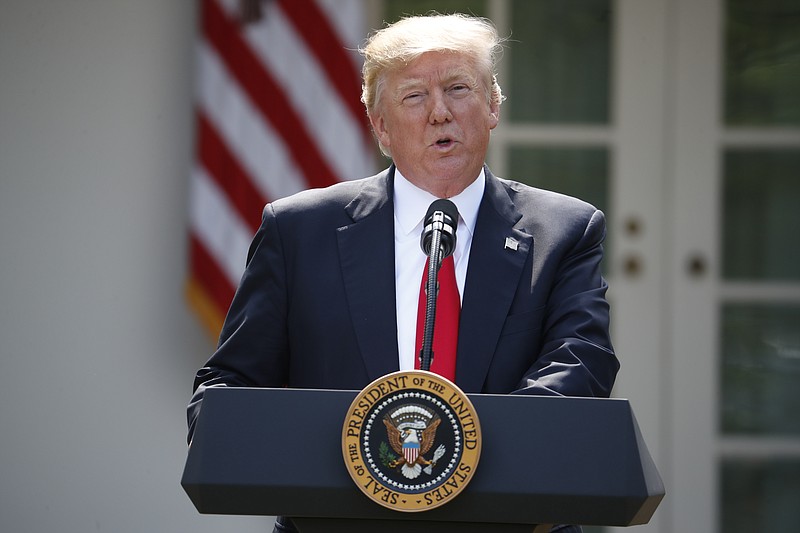 
              President Donald Trump speaks about the U.S. role in the Paris climate change accord, Thursday, June 1, 2017, in the Rose Garden of the White House in Washington. (AP Photo/Pablo Martinez Monsivais)
            