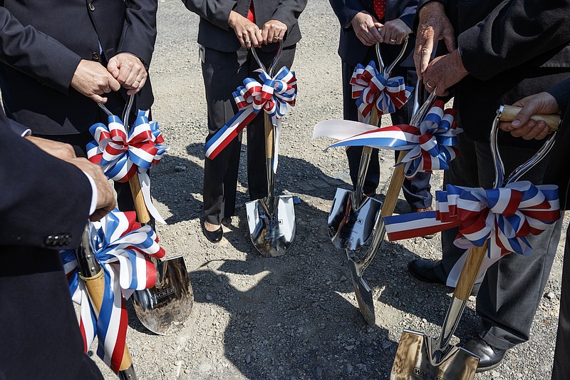 Wacker executives and guests hold shovels for a groundbreaking at the Wacker polysilicon manufacturing plant on Friday, June 2, 2017, in Chattanooga, Tenn. The manufacturer broke ground Friday on a multi-million dollar addition to its existing plant that will produce HDK pyrogenic silica.