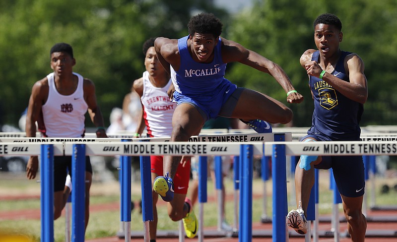 McCallie's Hakim McMorris is out ahead before a tumble over the final hurdle set him back while competing in the TSSA boys state championship Division II 110 meter hurdles on Friday, May 26, 2017, in Murfreesboro, Tenn. 