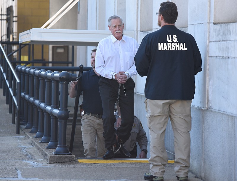 Former Tennessee Valley Authority engineer Robert Doggart is escorted from the Joel W. Solomon Federal Building in Chattanooga after his four count conviction of planning an attack on a Muslim community. 