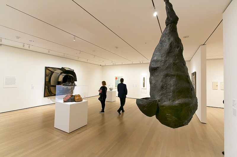 
              Louise Bourgeois' "The Quartered One," right, hangs in the Robert B. Menschel Gallery at the Museum of Modern Art in New York, Friday, June 2, 2017. The museum is dramatically expanding and reconfiguring its midtown Manhattan galleries that now draw more than 3 million annual visitors from around the world. The first phase of the $450 million project opens to the public Friday morning. (AP Photo/Richard Drew)
            