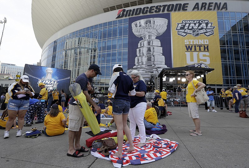 
              Nashville Predators fans set up to watch outside Bridgestone Arena before Game 3 of the NHL hockey Stanley Cup Finals between the Nashville Predators and the Pittsburgh Penguins Saturday, June 3, 2017, in Nashville, Tenn. (AP Photo/Mark Humphrey)
            