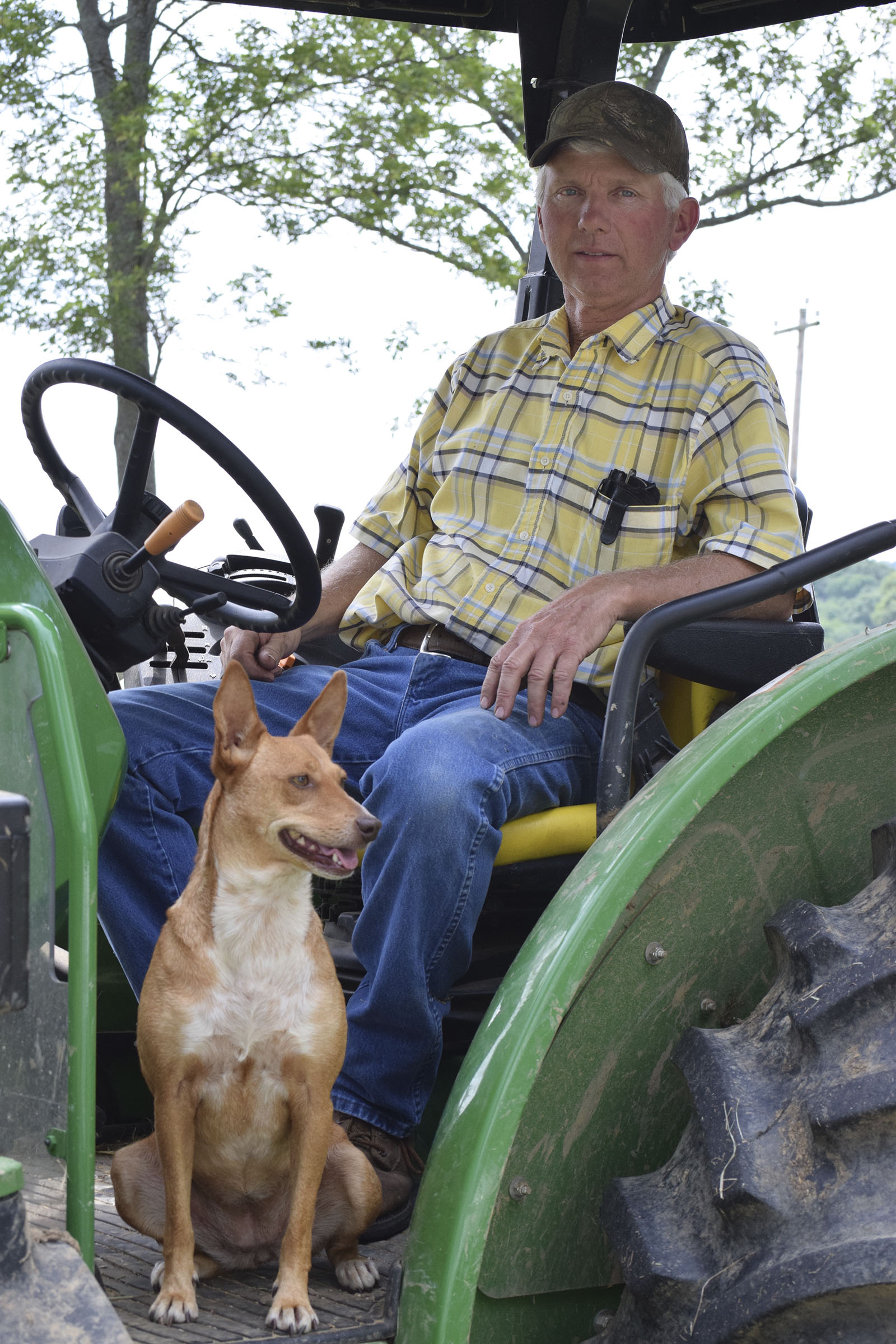 Tommy Cross, of Cross Farms on West Cove Road in southern Walker County, Ga., talks about the impact of last year's drought and this spring's rainy rebound on June 1, 2017, as his dog,